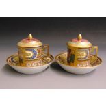 A pair of Vienna cans, saucers and covers, lavender ground, overlaid with bright enamels of blue red