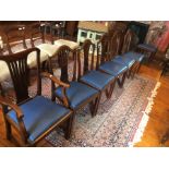 A harlequin set of eight camel back mahogany side chairs, together with a Chippendale style open