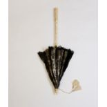 A Victorian parasol fashioned in Black lace with a silk cream underlining the handle & frame are in