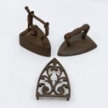 a collection of lace, one with a trivet Victorian.  the miniature irons used for items of lace,