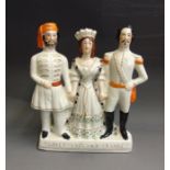 A Staffordshire Crimean figure of Abd-ul-Medjid, Queen Victoria & Napoleon Bonaparte III, titled ‘