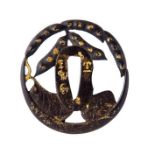 A Japanese iron tsuba, 18th/19th Century, formed as openwork bean pods and leaves, gilt inscription