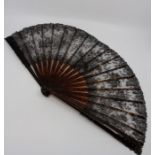 A Black finley patterned lace fan with tortoiseshell sticks. (1900's) (15).  A Tortoishell fan which