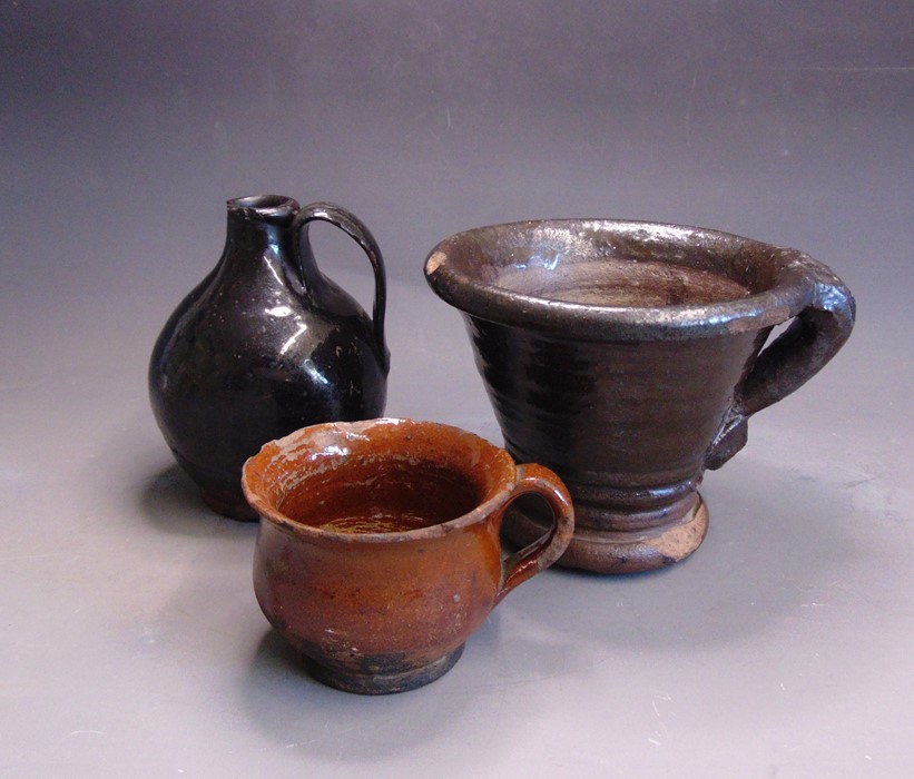 Post Medieval pottery, a mortar, an earthenware lead glazed cup and a black glazed Jug, mortar 16.