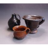 Post Medieval pottery, a mortar, an earthenware lead glazed cup and a black glazed Jug, mortar 16.