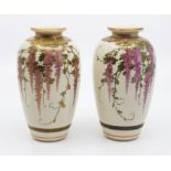 A pair of Japanese satsuma baluster vases, Meiji period, 1868-1912, decorated with pink blossom,
