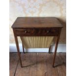 An Early 19th Century rosewood sewing table, with a single frieze drawer above a wool basket