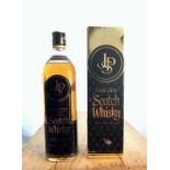 A boxed bottle of JPS Scotch Whisky