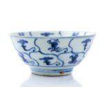 A Chinese Tek Sing blue and white bowl, a central roundel with radiating cells, double blue circle