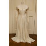 A 1949 vintage full length wedding dress in Ivory silk & integral shaped train handmade in 1949.