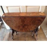 A Victorian burr walnut quarter veneered Sutherland table, circa 1870, raised on turned column