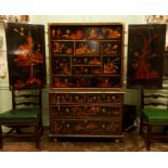 A 19th Century Chinese Export black japanned cabinet on stand, who whole decorated throughout with