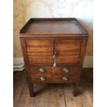 A George III oak commode, circa 1780, rectangular top above a two door cupboard with two short
