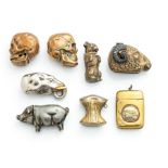 Eight assorted early 20th Century brass and nickel novelty vesta case, to include two skulls, a pig,