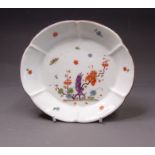 A Meissen lobed dish painted with flowers and insects, the reverse is yellow ground, circa 1753