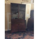 A George III mahogany secretaire bookcase, the upper section with two glazed doors, the lower