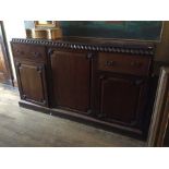 A late Victorian mahogany pagoda topped sideboard, fitted with two drawers and three doors, the