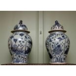 A large pair of 19th Century Chinese provincial blue and white temple vases and covers, beast