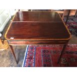 A George III mahogany and satinwood inlay fold top tea table, circa 1780, a folding rectangular