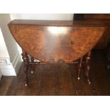 A Victorian figured walnut quarter veneered Sutherland table, circa 1860, raised on turned