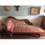 A Victorian mahogany chaise longue, scroll carved back, deep buttoned upholstery to back and