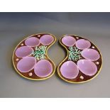 Two continental Majolica kidney shaped oyster plates, brown glazed with puce oyster insets and green