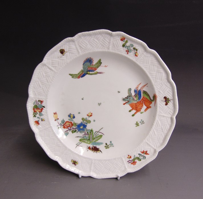 A Meissen plate with a moulded rim with the Sulkoski-Ozier pattern and decorated in the Kakiemon