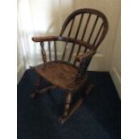 A 19th Century childs' ash Windsor rocking armchair