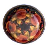 A Moorcroft pomegranate bowl, circa 1925, impressed marks and blue script signature, diameter 20cm