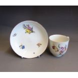 A Meissen coffee cup and saucer painted with floral sprays, saucer has a brown painted rim line,