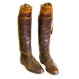 A pair of early 20th Century tan leather military boots, with Hawkes and Co wooden stays (2)