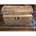 A George IV Cowhide trunk, circa 1825, brass beaded decoration around the edge with metal locks