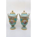 A pair of Augustus Rex vases and covers. Turquoise ground with painted panels of courting couples,