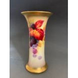 A Royal Worcester vase painted with autumnal and berries. shape G923, signed Kitty Blake, date code