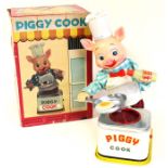 Piggy Cook: A boxed, battery operated, Piggy Cook, Made by Yonezawa, Japan, complete within original