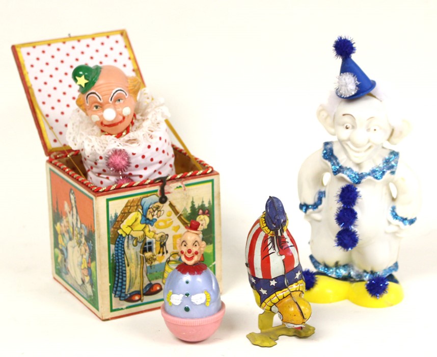 Clowns: A collection of four unboxed tinplate/plastic clowns to comprise: Clown Jack in a Box,