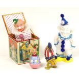 Clowns: A collection of four unboxed tinplate/plastic clowns to comprise: Clown Jack in a Box,