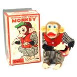 Crap Shooting Monkey: A boxed, battery operated, tinplate, Crap Shooting Monkey, Made by Alps,