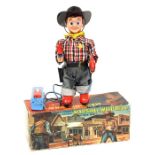 Marshal Wild Bill: A boxed, battery operated, tinplate, Marshal Wild Bill, Two Gun Man, remote