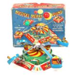 Musical Merry-Go-Round: A boxed 1960's, clockwork, tinplate, Musical Merry-Go-Round, working