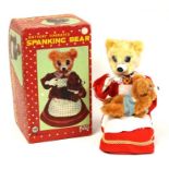 Spanking Bear: A boxed, battery operated, tin and plush, Spanking Bear, Made by Linemar, Japan,
