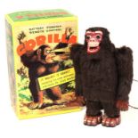 Gorilla: A boxed, battery operated, tinplate, Gorilla, with remote control, Made by Nomura (T.N),