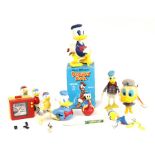 Donald Duck: A collection of assorted Donald Duck items to comprise: a boxed, plastic, clockwork,