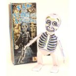 Sam the Strolling Skeleton: A boxed clockwork, tinplate, Sam the Strolling Skeleton, Made by Mikuni,