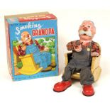 Smoking Grandpa: A boxed, battery operated, tinplate, Smoking Grandpa, Made by Marisan, Japan,