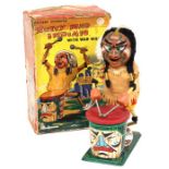 Nutty Mad Indian: A boxed, battery operated, tinplate, Nutty Mad Indian with War Whoop, Made by
