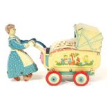 Haji: An unboxed Haji, Mother Pushing Pram, tinplate, clockwork, Made by Haji, Japan, height approx.