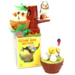 Feeding Bird Watcher: A boxed, battery operated, tin and plush, Feeding Bird Watcher, Made by