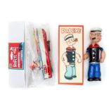 Popeye: A boxed, celluloid, wind-up Popeye, Made by King Features, complete within reproduction box,