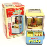 Lucky Crane: A boxed, battery operated, tinplate, Lucky Crane, Made by Modern Toys, Japan,